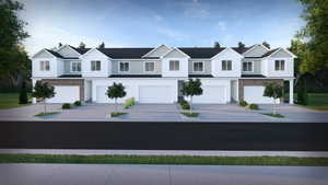 View of front facade featuring board and batten siding, concrete driveway, and a garage