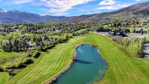 Building 4 with aerial views of the course and mountains