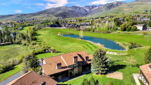 Building 4 with aerial views of the course and mountains