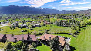 Building 4 with aerial views of the course and mountains