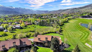 Building 4 with aerial views of the course and mountains
