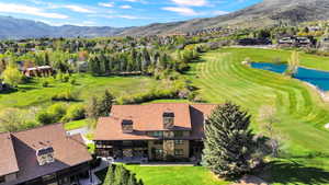 Building 4 with aerial views of the course and mountains