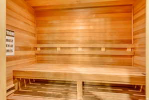Relaxing sauna with wood walls and wood ceiling