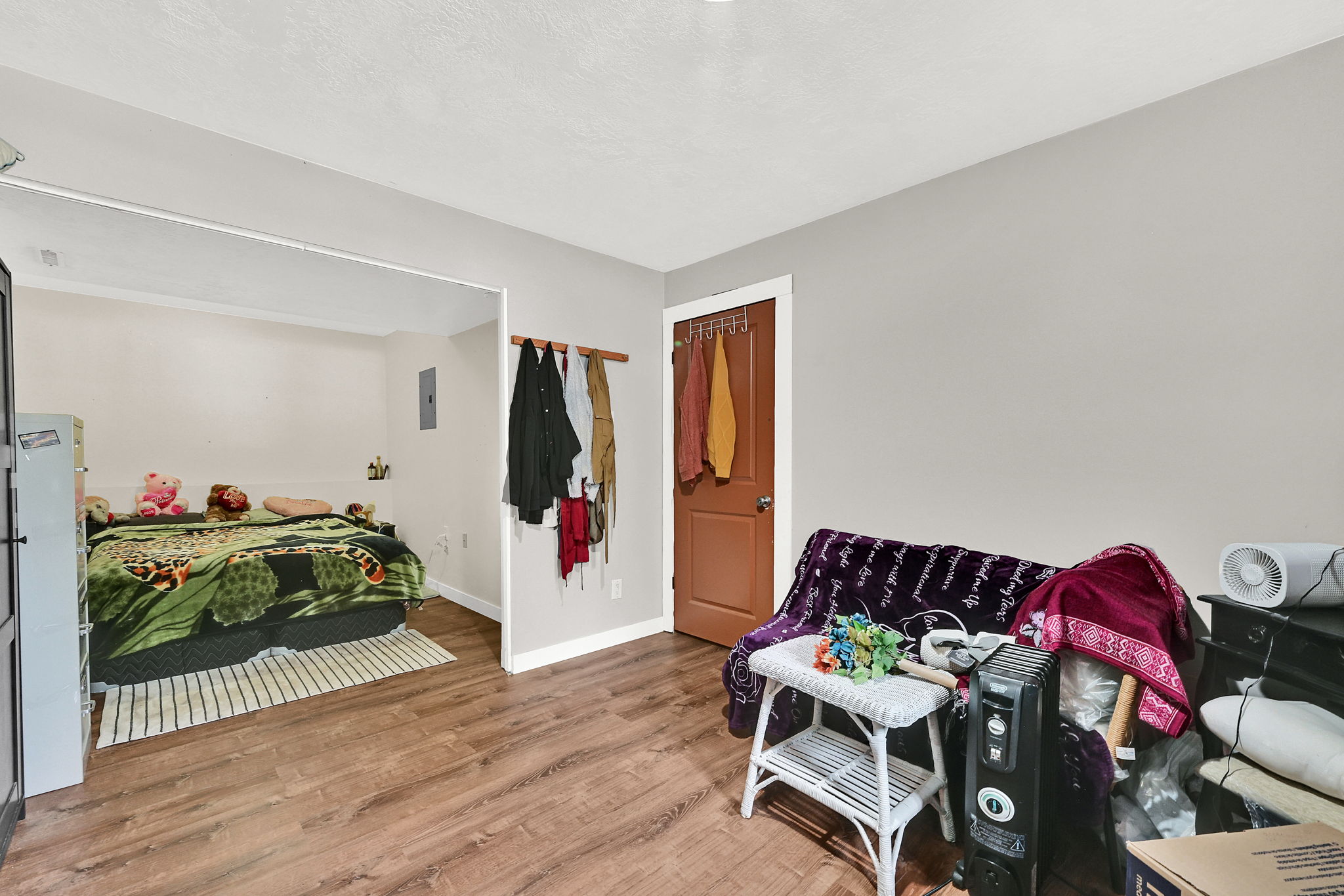Bedroom with baseboards and light wood-type flooring