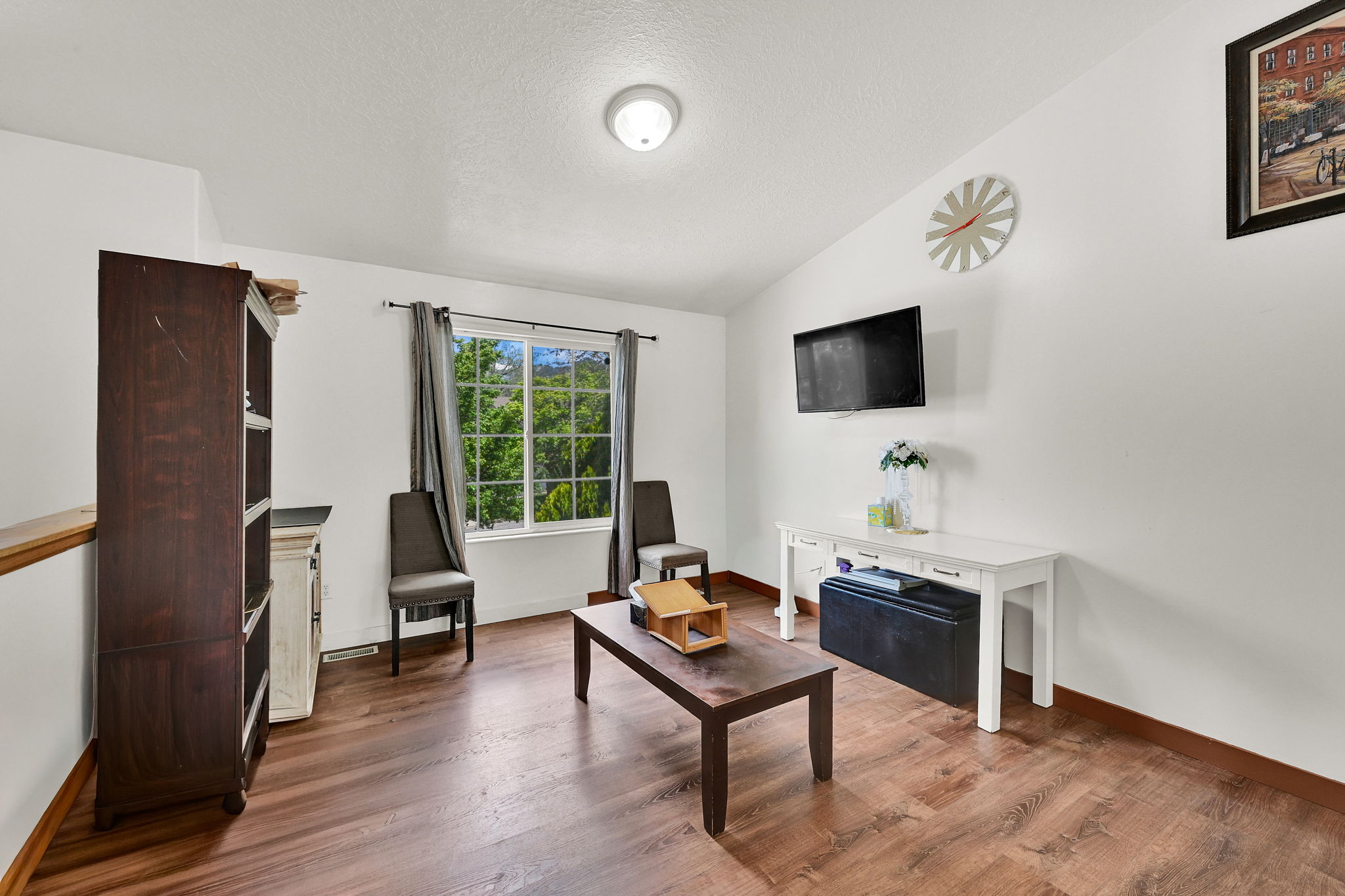Living area featuring wood finished floors and baseboards