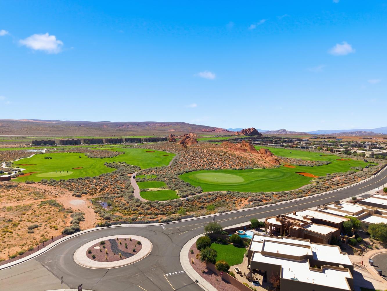 Drone / aerial view of mountains and a local golf course
