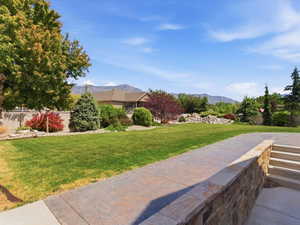 Expansive lawn with mature trees and diverse landscaping