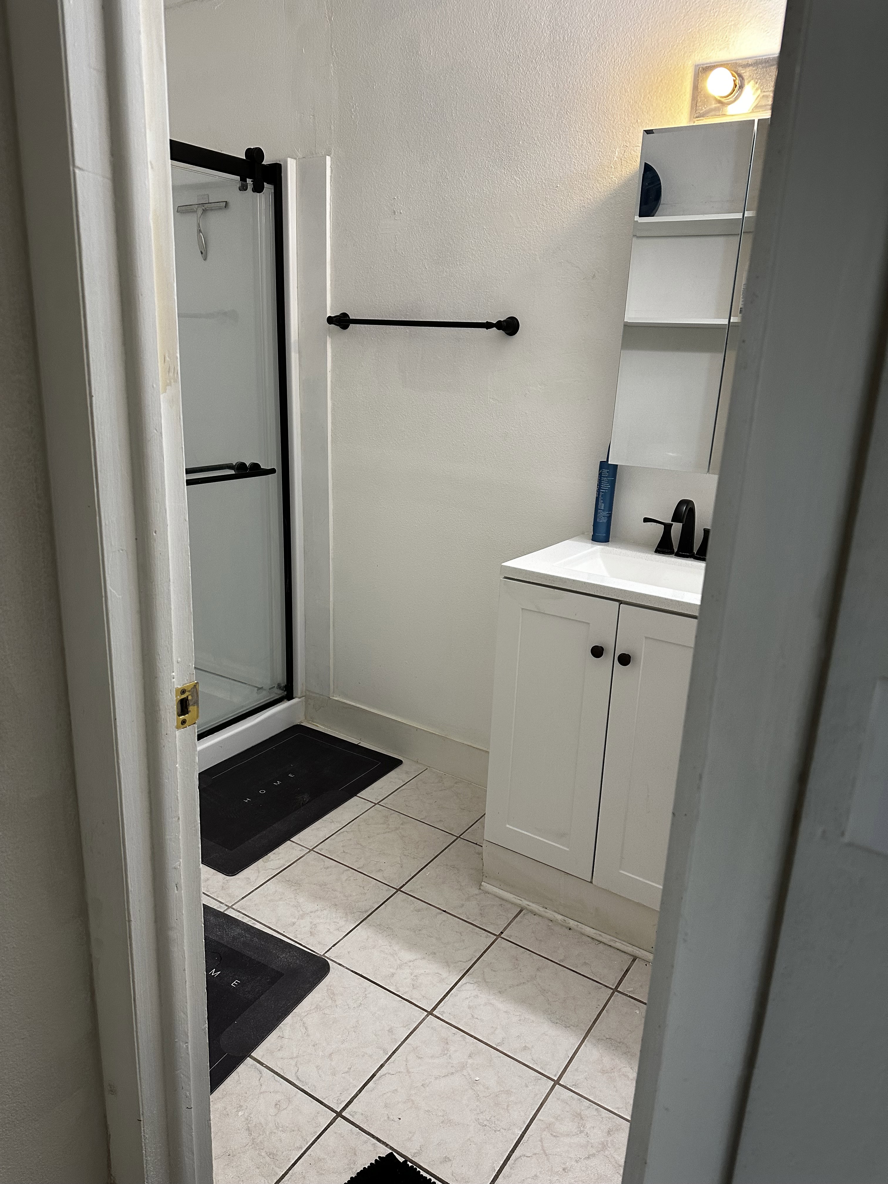 Additional bathroom view featuring vanity and storage.
