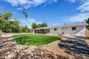 Rear view of house with stucco siding