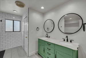 Full bathroom with double vanity, light tile patterned flooring, recessed lighting, and a closet