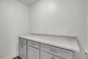 Bathroom with vanity and dark wood-style flooring