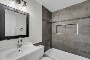 Full bathroom featuring shower / washtub combination and vanity