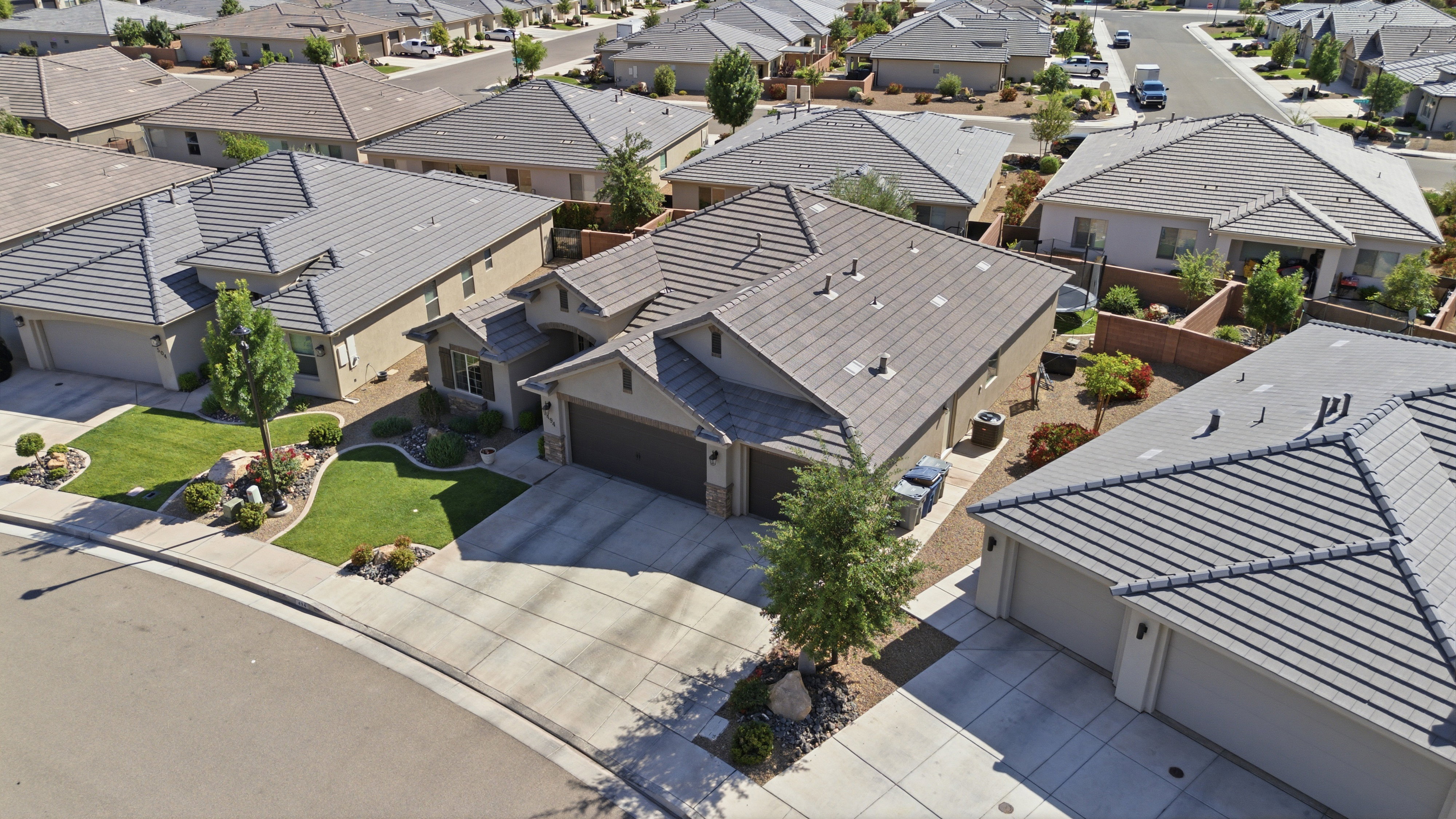 Aerial perspective showcasing a residential property with a tiled hip roof