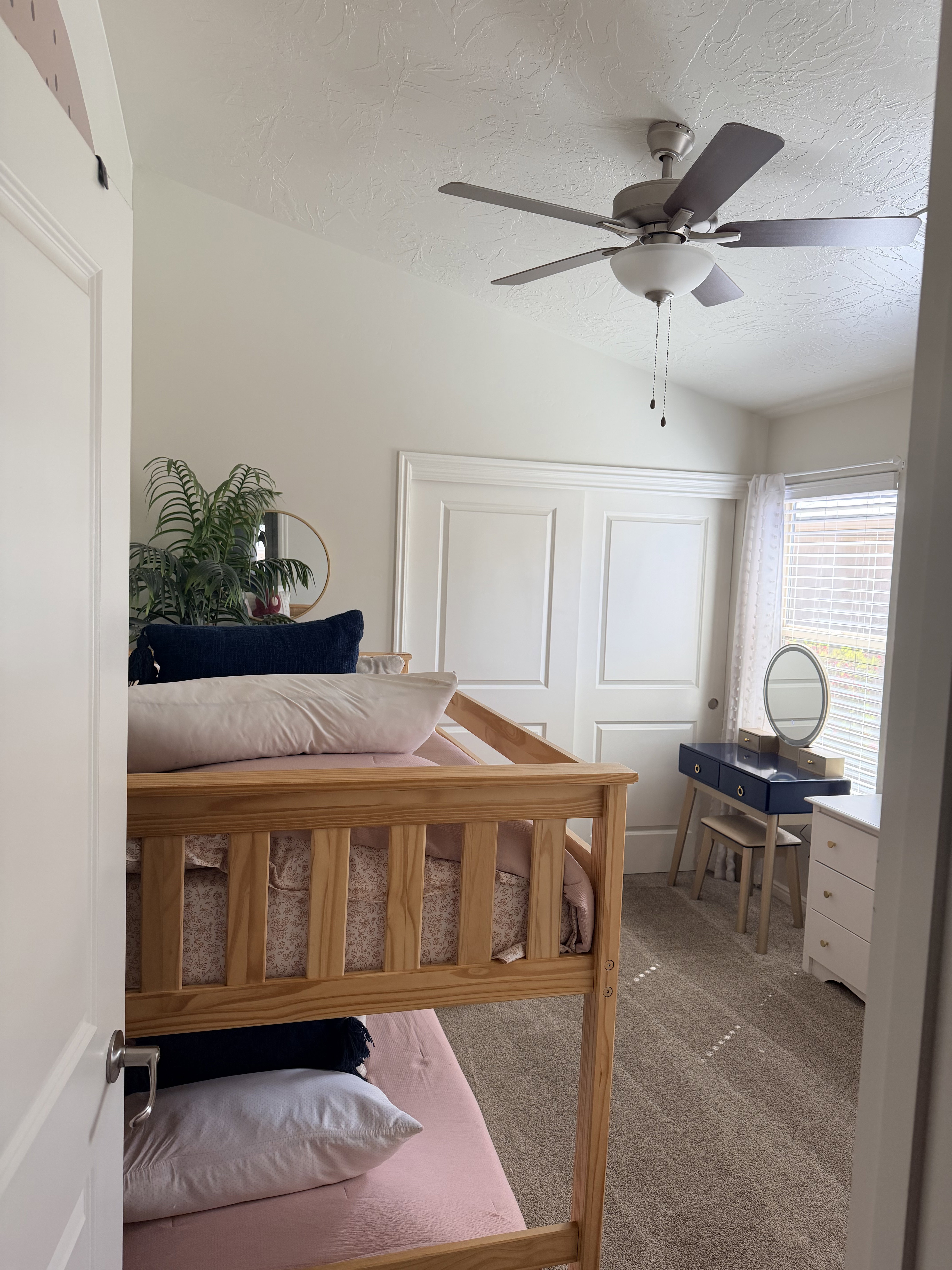 Bedroom with carpet floors, a closet, and ceiling fan