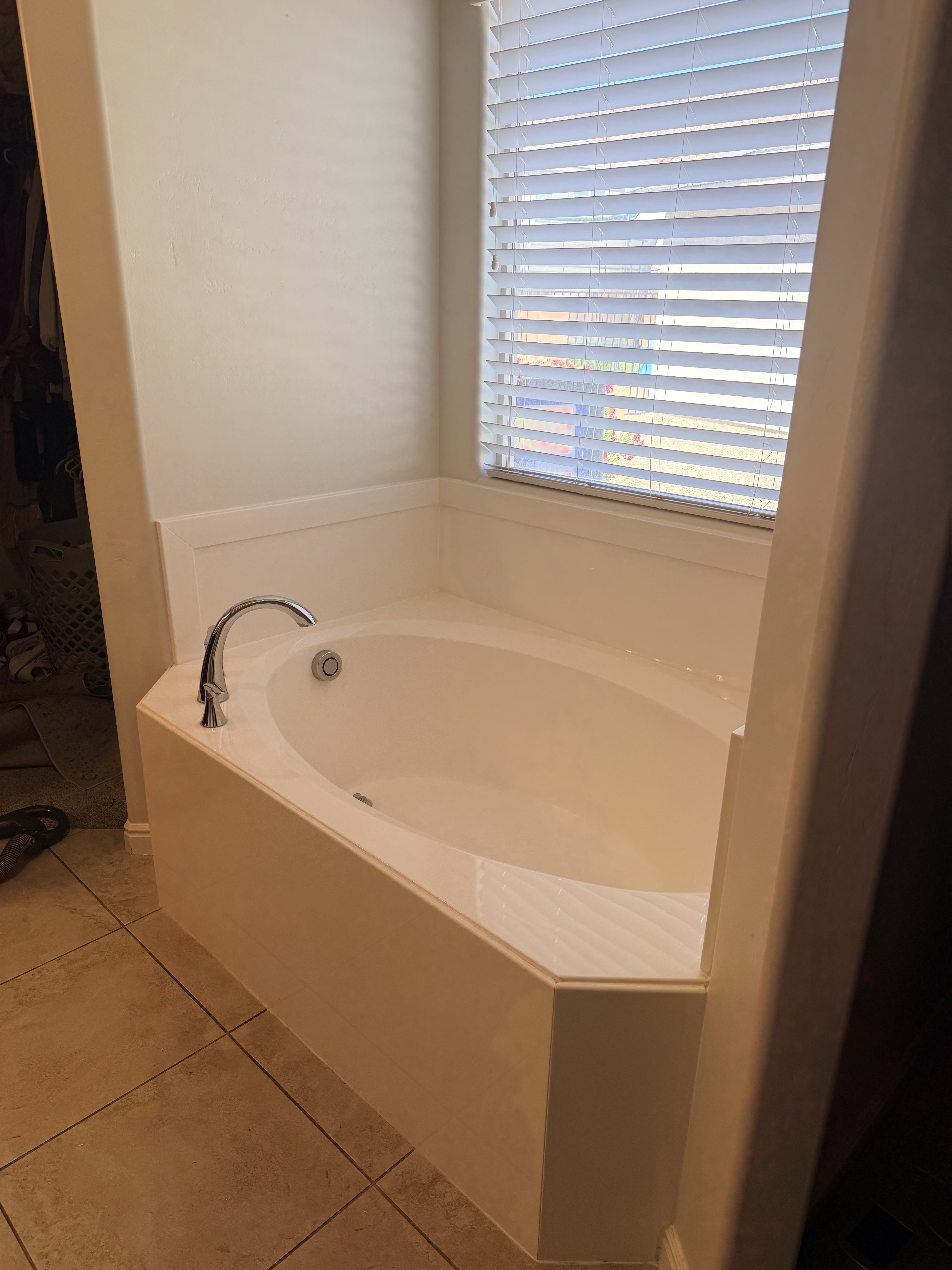 Full bathroom with a bath and light tile patterned floors