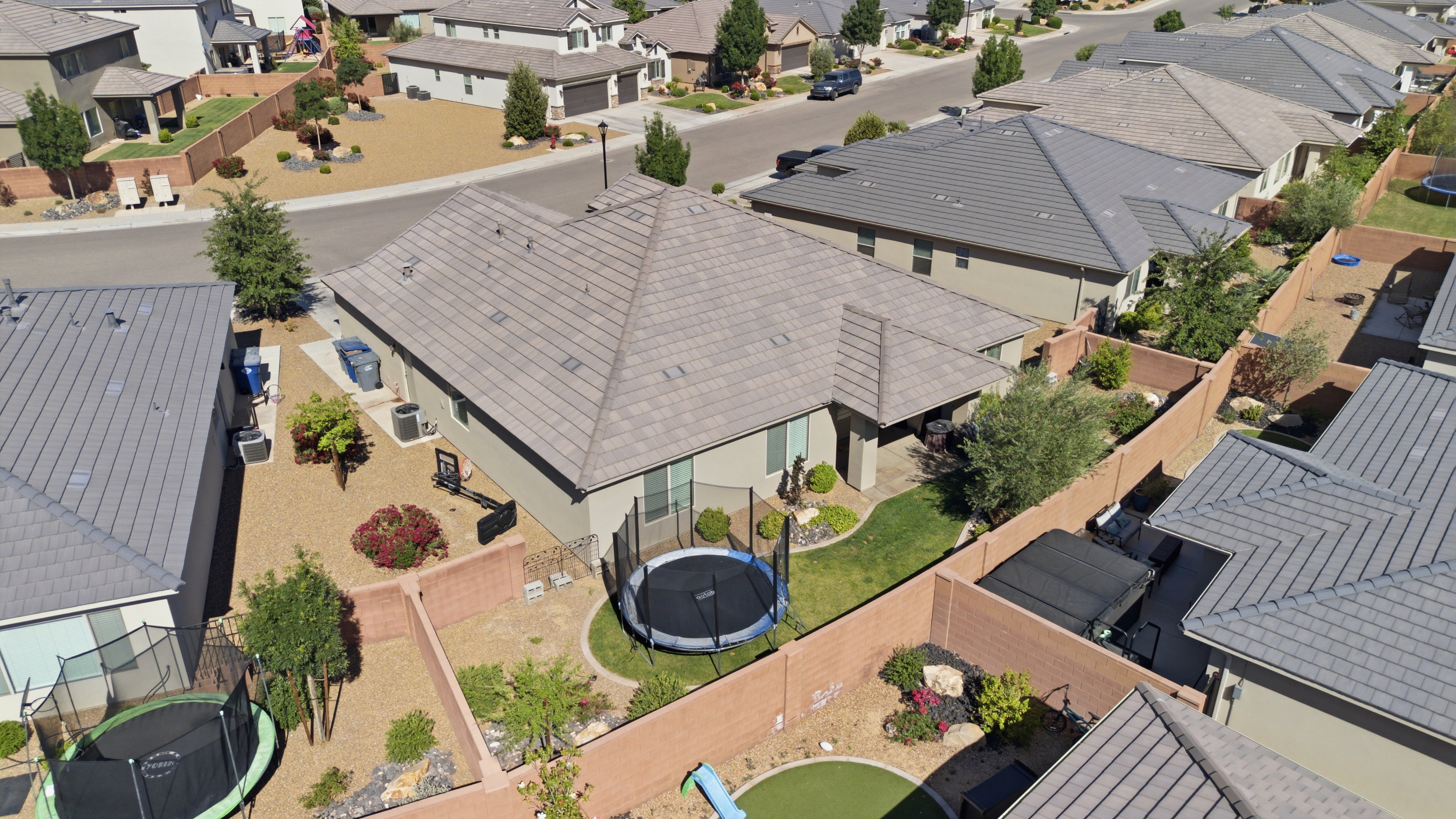 Aerial view highlighting the property's rear exterior and landscaping
