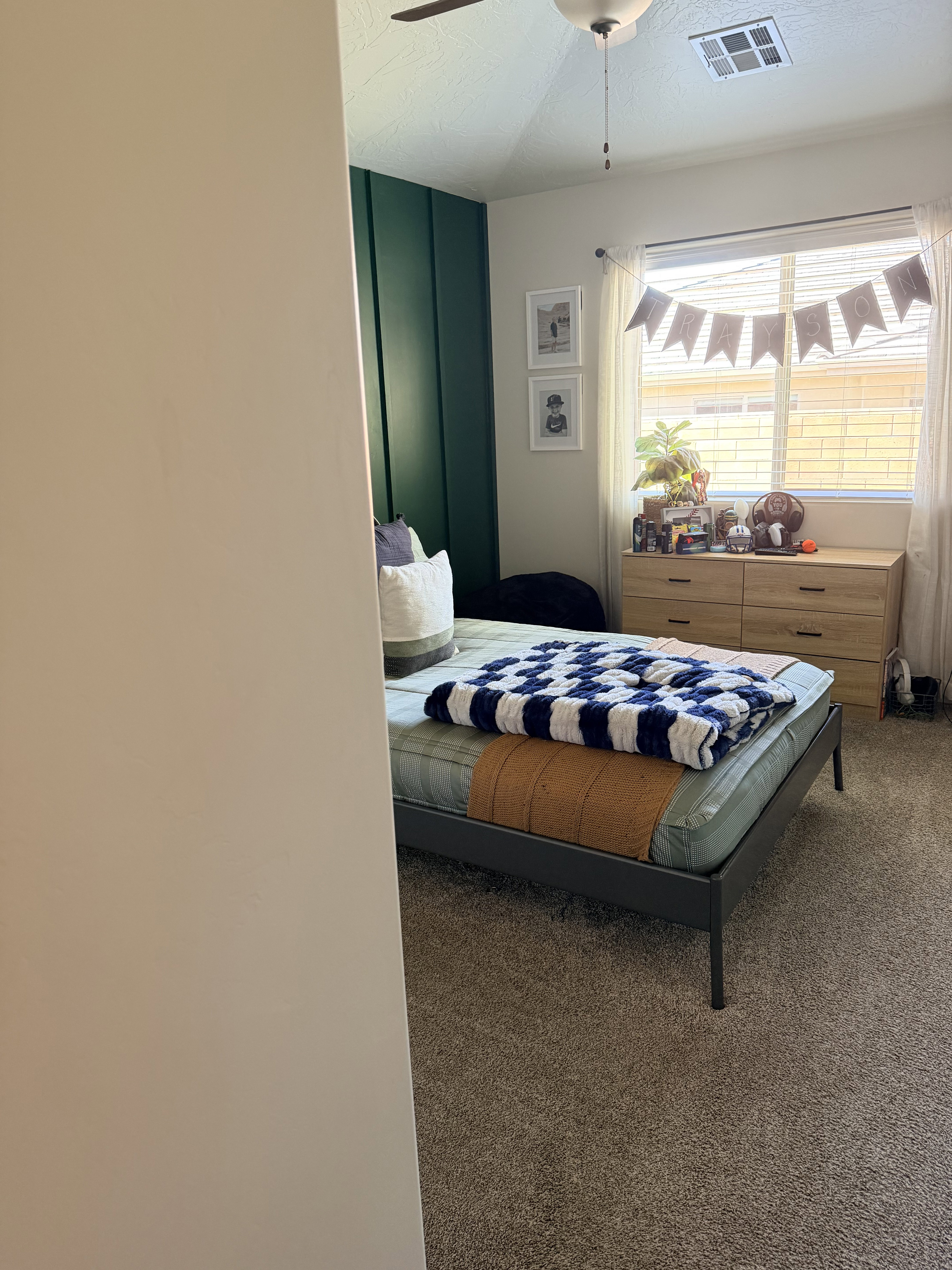 Bedroom featuring dark carpet, a ceiling fan, and a textured ceiling