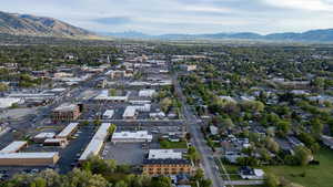 Aerial view of property and surrounding area with mountains