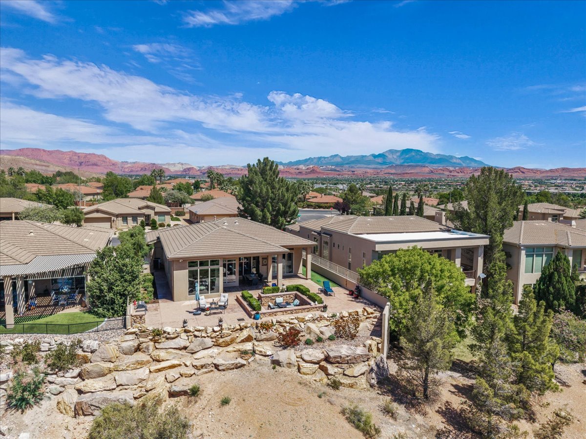 Aerial perspective of suburban area featuring a mountain backdrop