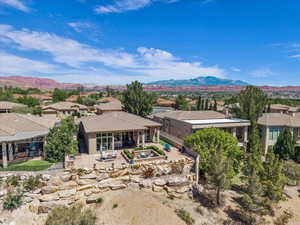 Aerial perspective of suburban area featuring a mountain backdrop