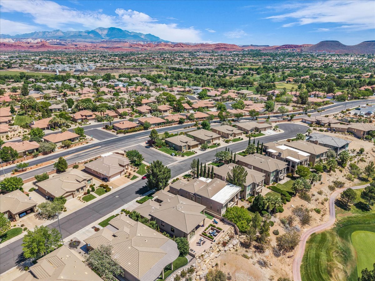 Aerial view of residential area featuring mountains