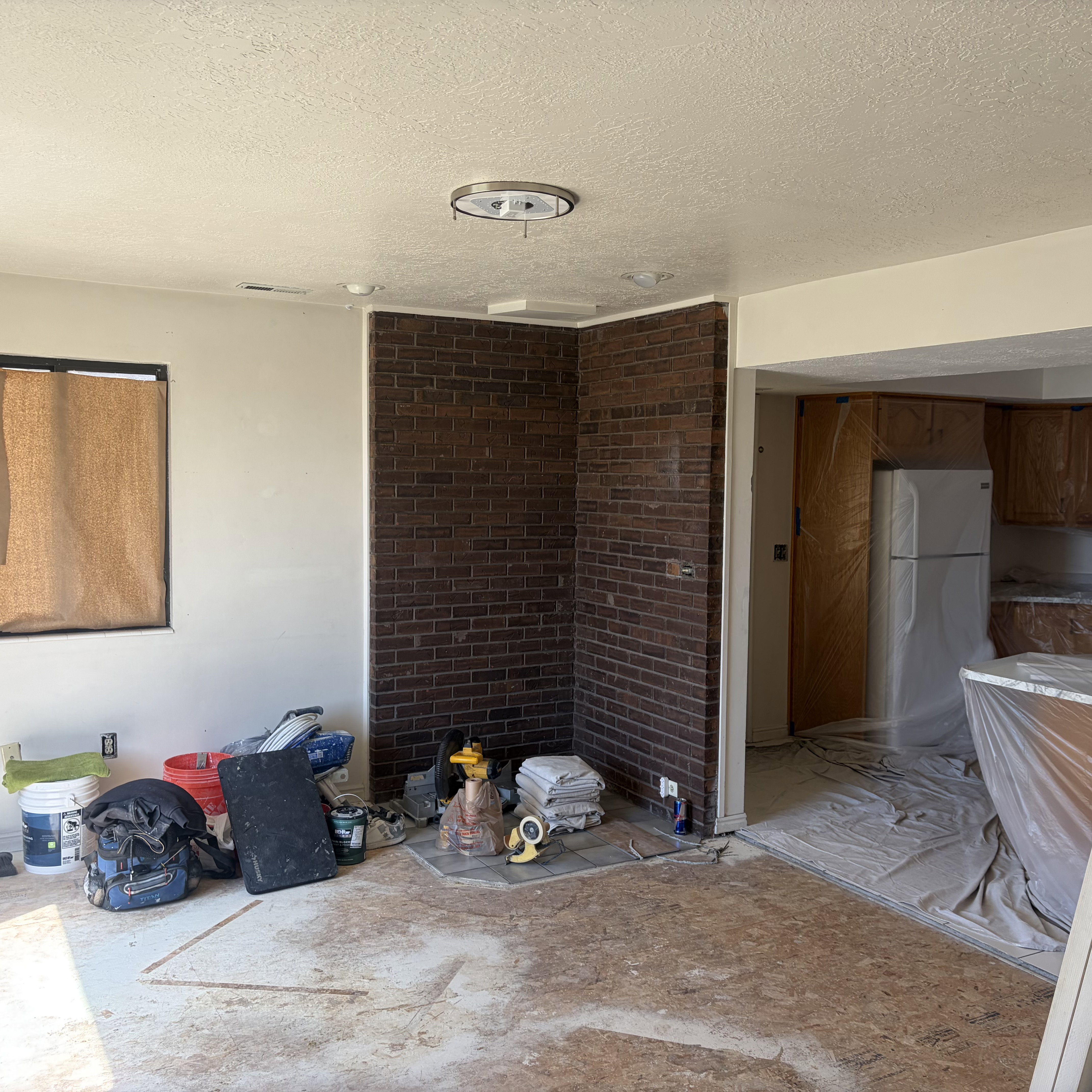 Unfurnished dining area with a textured ceiling