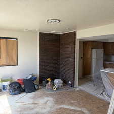 Unfurnished dining area with a textured ceiling