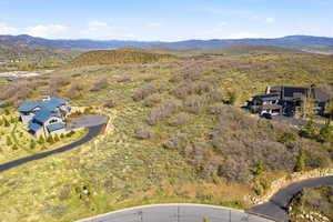 View from above of property with a mountain backdrop