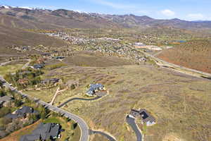View of property location with mountains and nearby suburban area