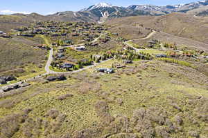 Aerial view of residential area featuring a mountainous background