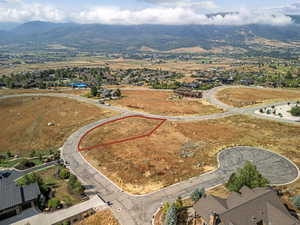 Expansive undeveloped lot featuring a natural landscape and paved road frontage