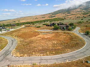 Aerial view of sparsely populated area featuring a mountainous background