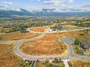 View of property location with a mountain backdrop and nearby suburban area