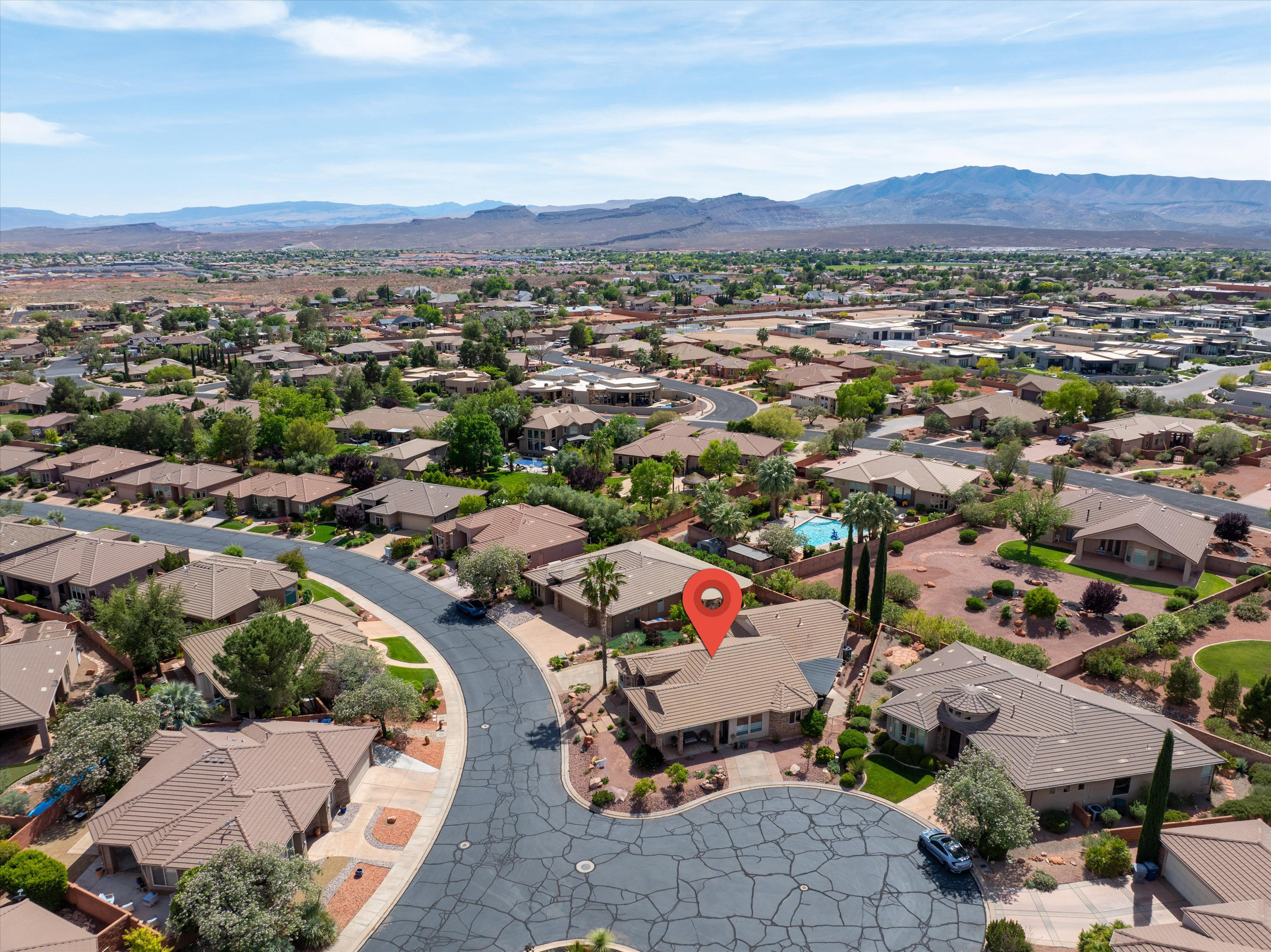 Aerial view of residential area with a mountainous background