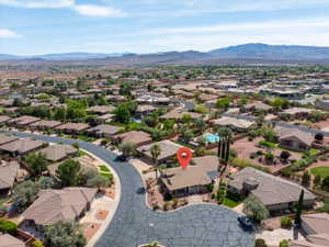 Aerial view of residential area with a mountainous background
