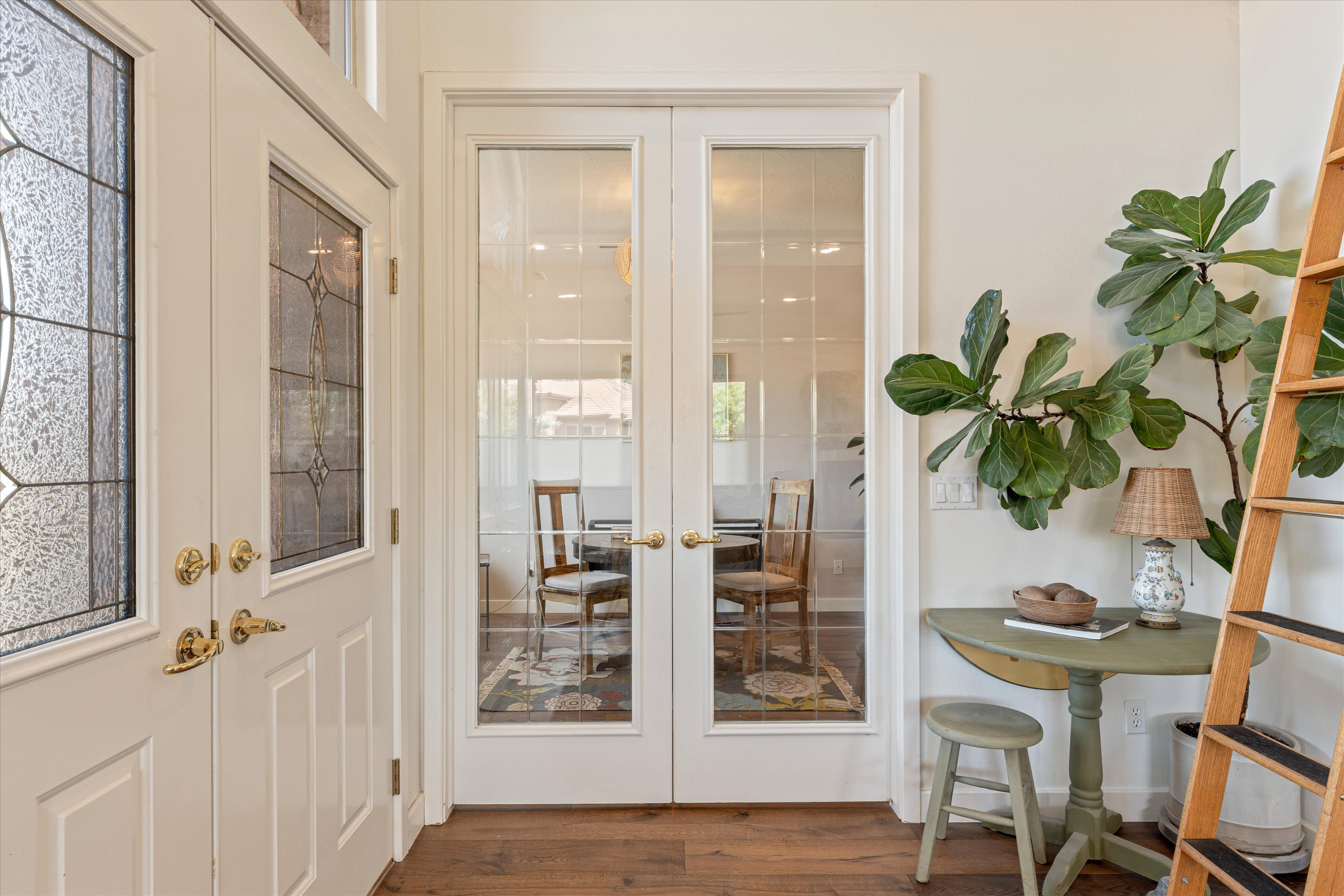 Doorway to outside with french doors and wood finished floors