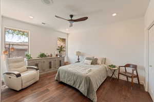 Bedroom featuring dark wood finished floors, a ceiling fan, and recessed lighting