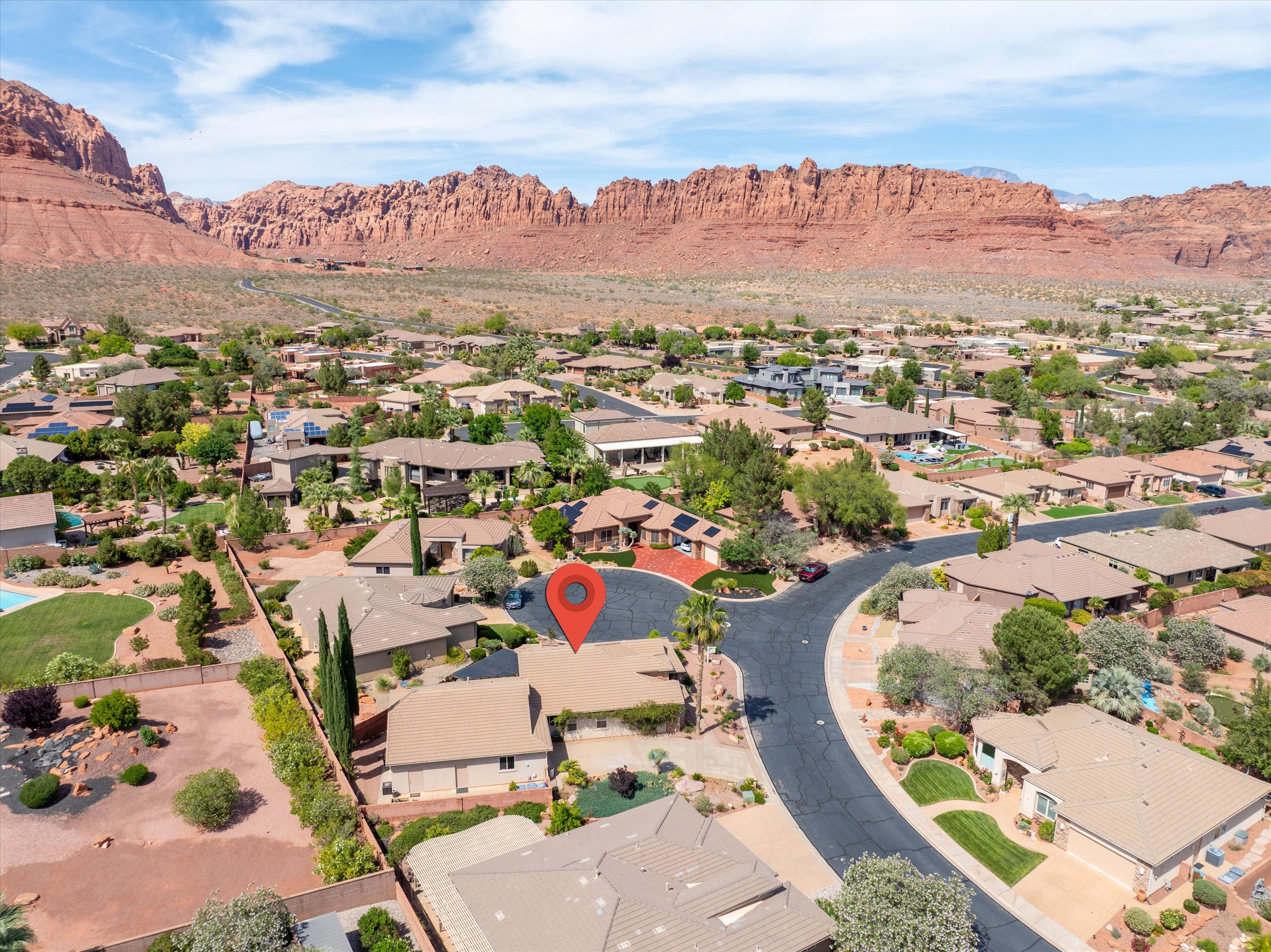 Aerial view of residential area featuring mountains