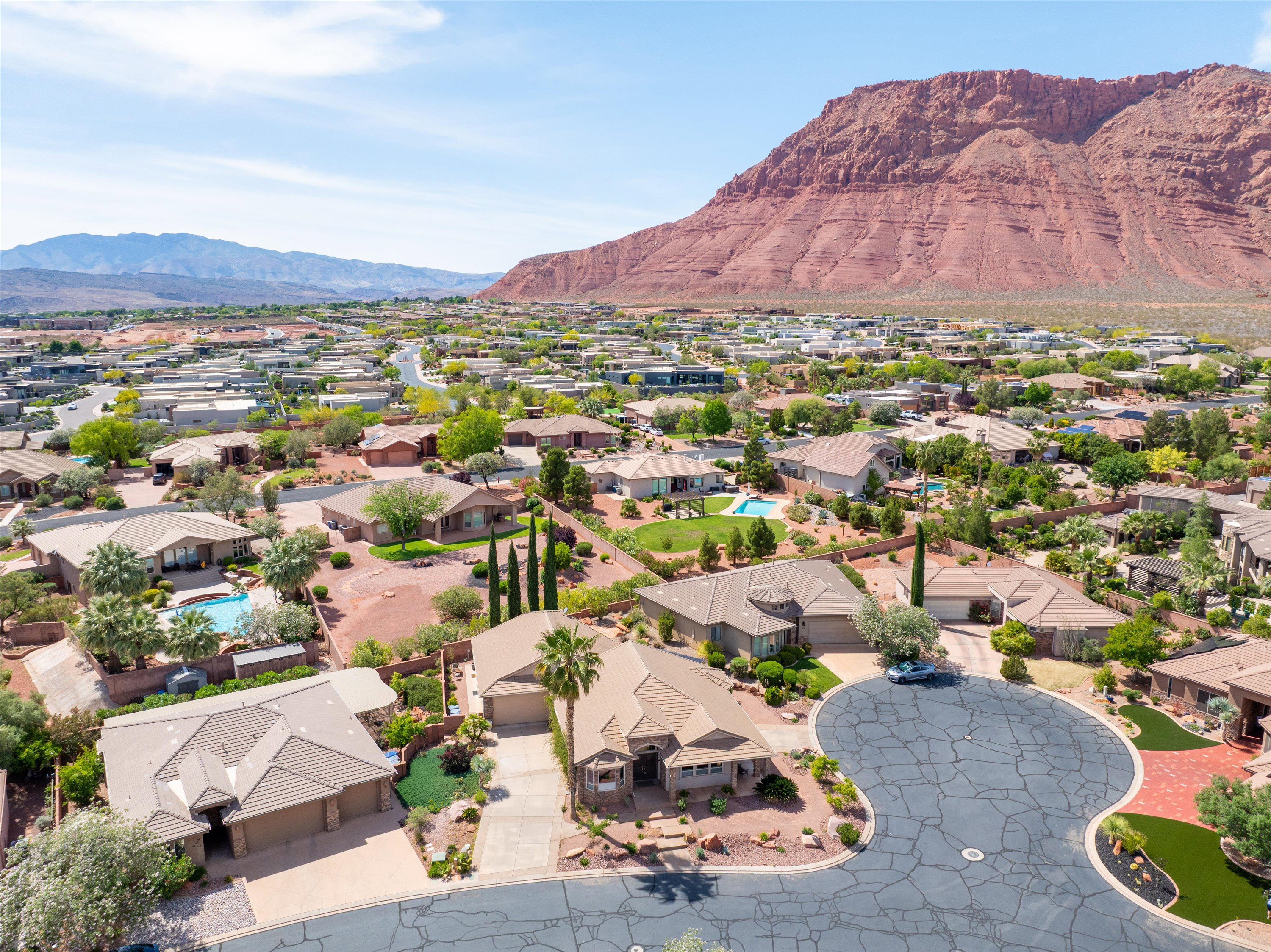 Aerial perspective of suburban area with a mountain backdrop
