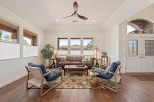 Living room featuring ceiling fan, hardwood / wood-style floors, recessed lighting, and vaulted ceiling