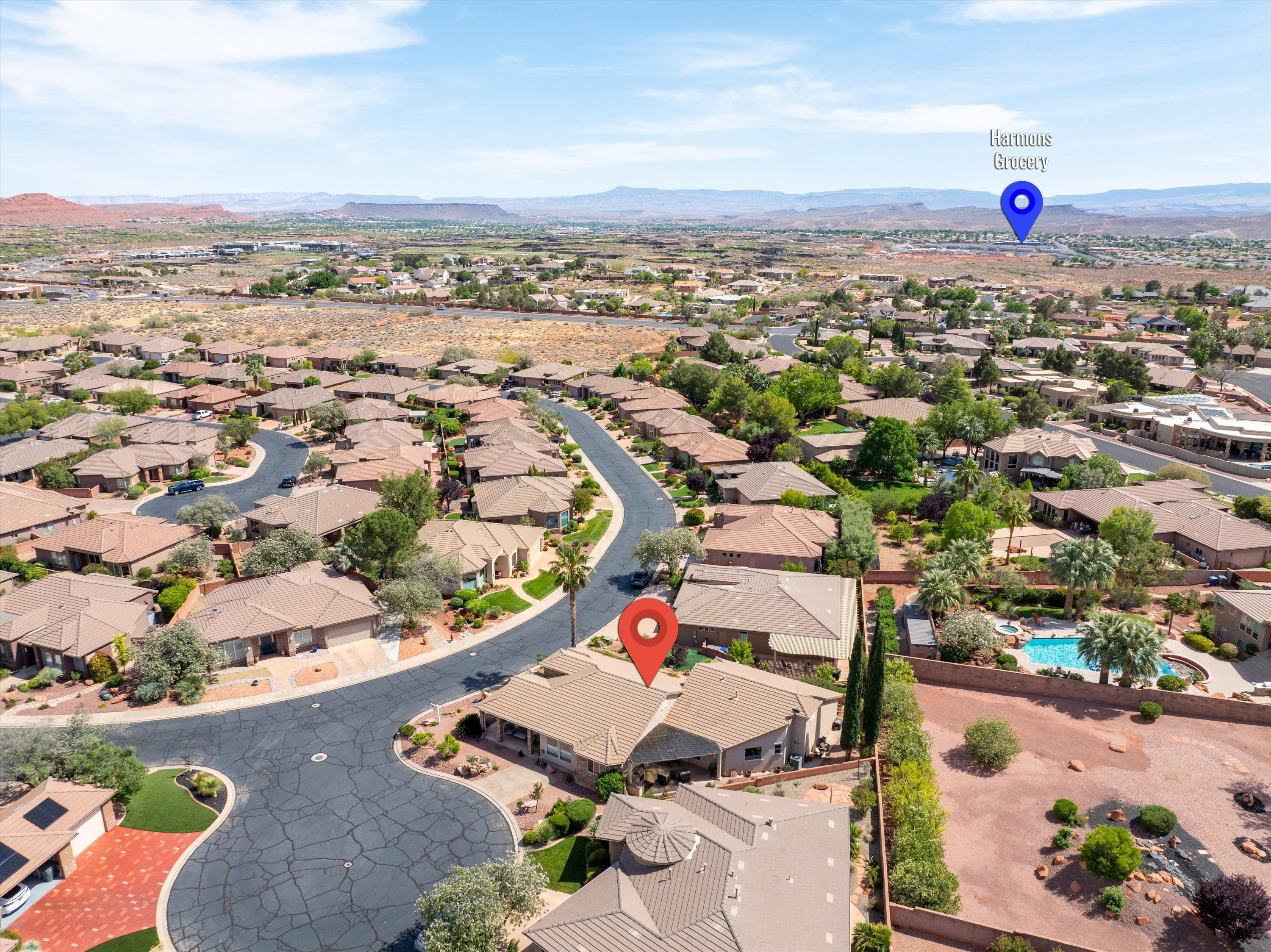 Aerial view of residential area featuring mountains