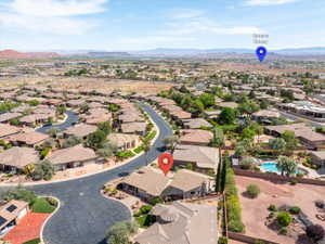 Aerial view of residential area featuring mountains