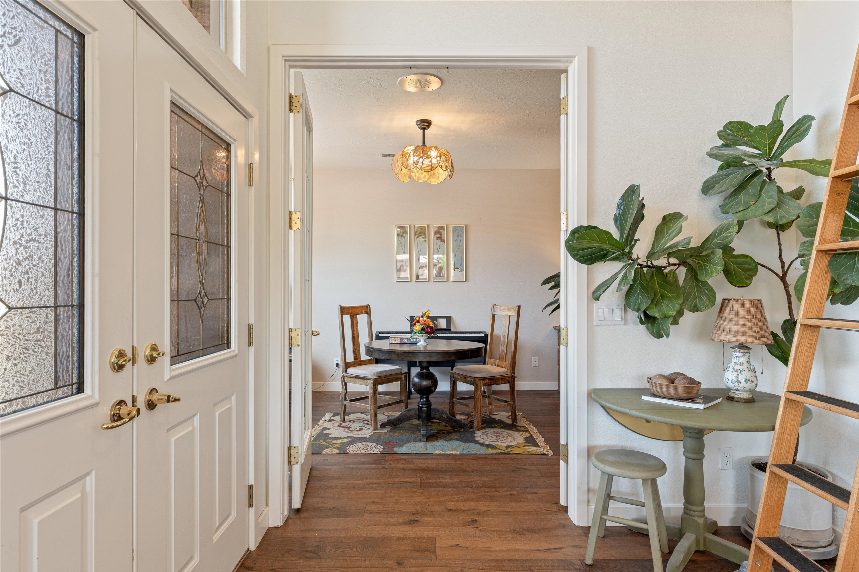 Dining room with dark wood finished floors and baseboards