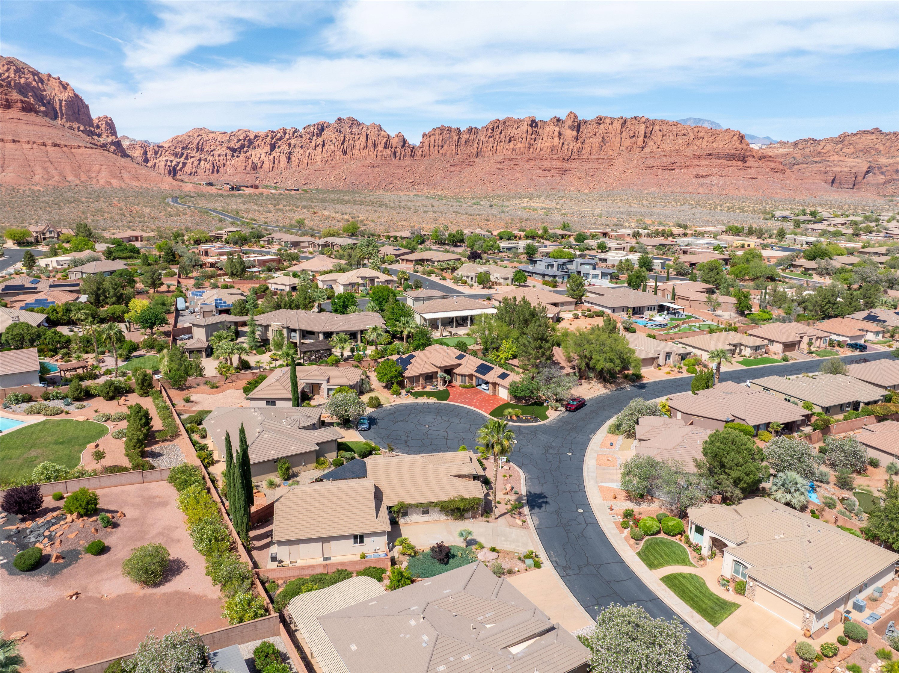 Aerial view of residential area featuring a mountainous background