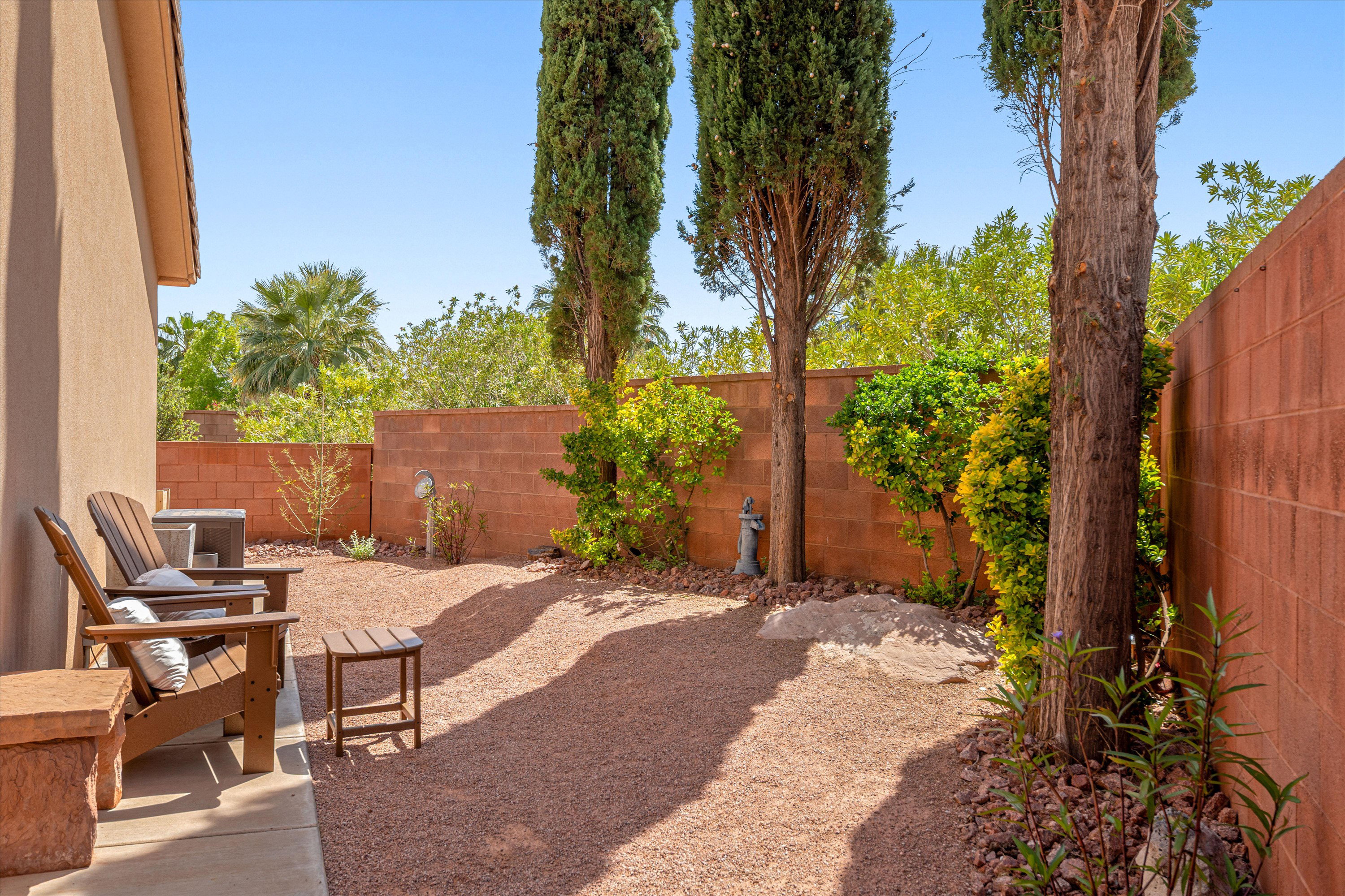 Fenced backyard featuring a patio