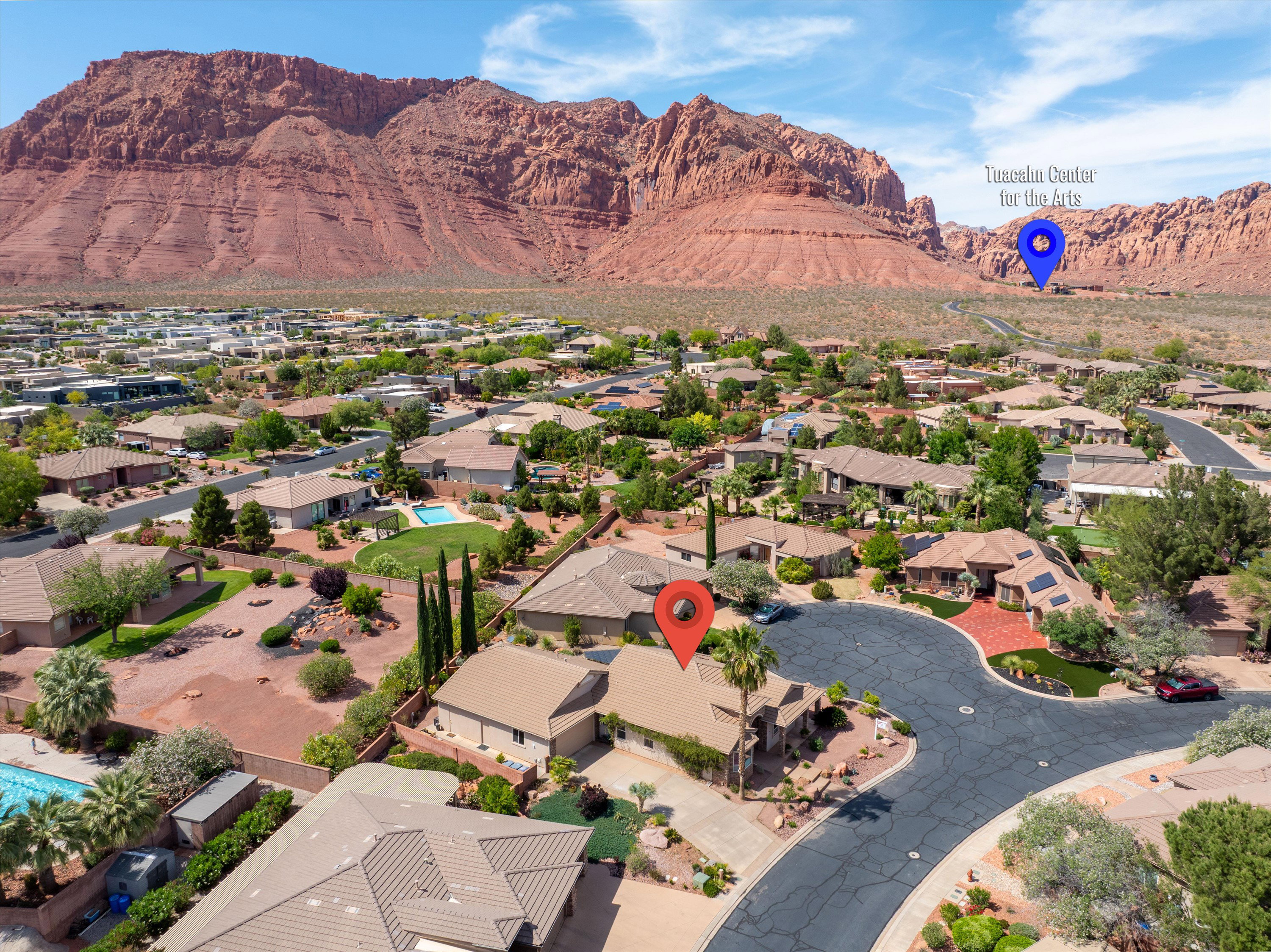 Aerial view of residential area featuring a mountain backdrop