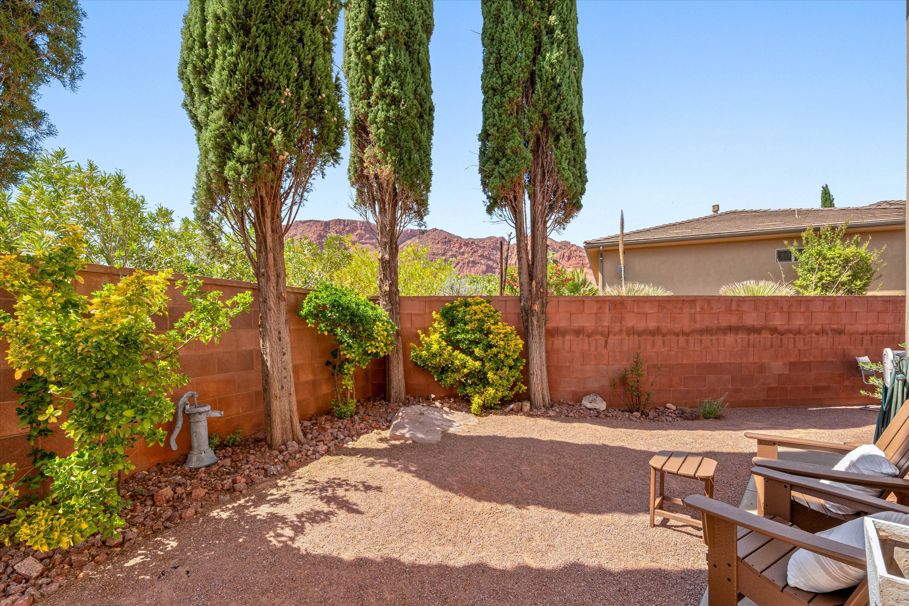 Fenced backyard with a mountain view