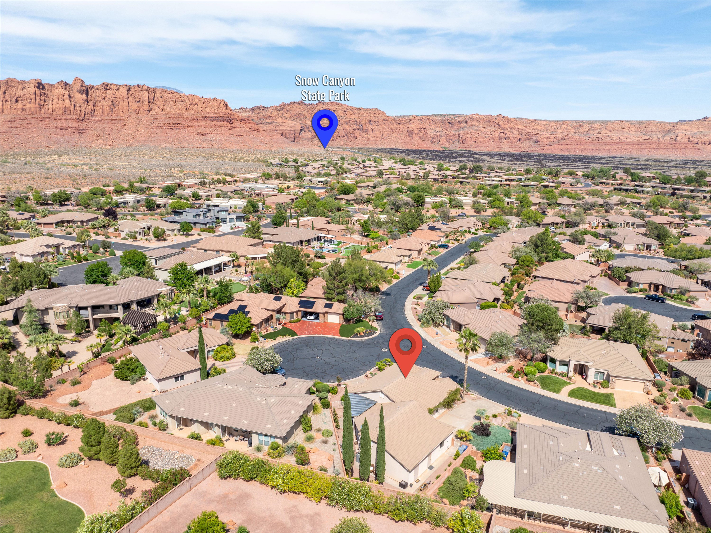 Aerial view of residential area featuring mountains