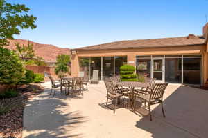 Expansive concrete patio with multiple outdoor seating areas
