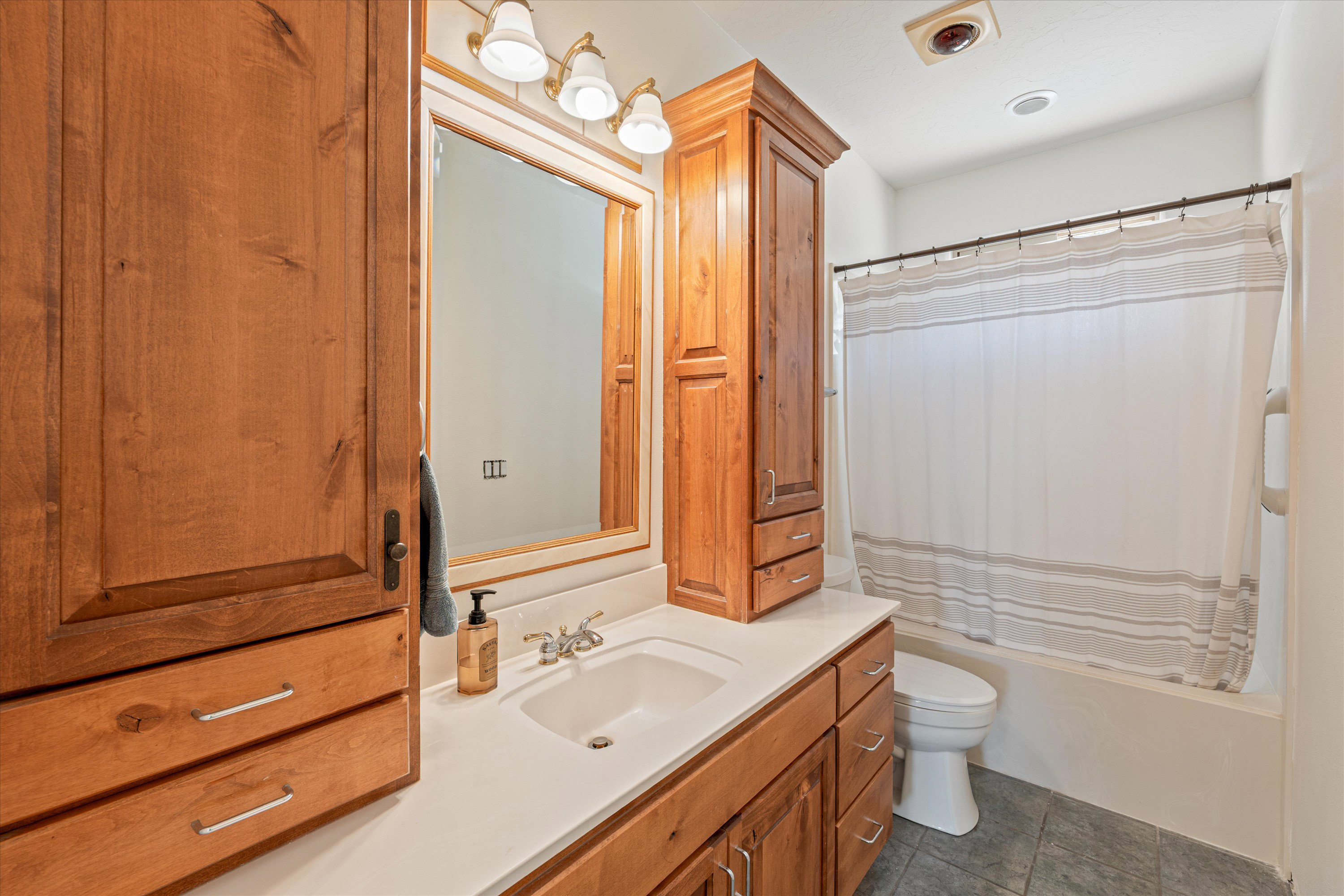 Full bathroom with vanity and shower / tub combo